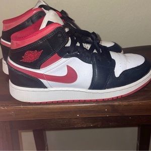 Women’s size 5Y Red and black Jordons.